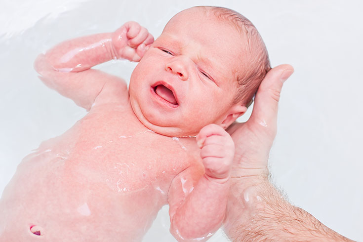 bathing newborn