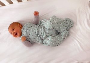 Swaddling your baby – Arms in or out?